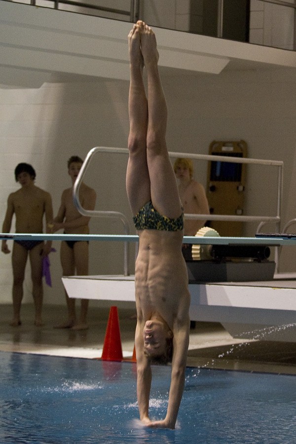 Redmond High sophomore Eric Klassen finishes off a dive at the 4A state swim and dive meet last weekend at the King County Aquatics Center in Federal Way. Klassen finished fourth overall