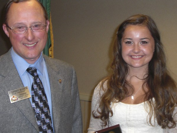 Redmond Rotary President Steve Bozick presented Redmond High School junior Bailey Jenks with a plaque for being selected Junior Student of the Month for April.