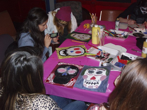 Teens participate in skull painting in this year's Day of the Dead event at the Old Fire House Teen Center last week.