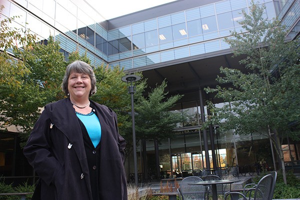 Kim Allen stands in the back side of Redmond City Hall. She is running for her third term for Pos. 4 with City Council.