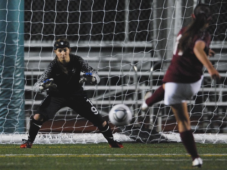 Mustangs goalkeeper Marianna Castro (19) attempts to stop a Eastlake kick during an overtime shootout during the Kingco 4A tournament playoff game at Skyline Tuesday night. Redmond's season ended with the shootout loss.