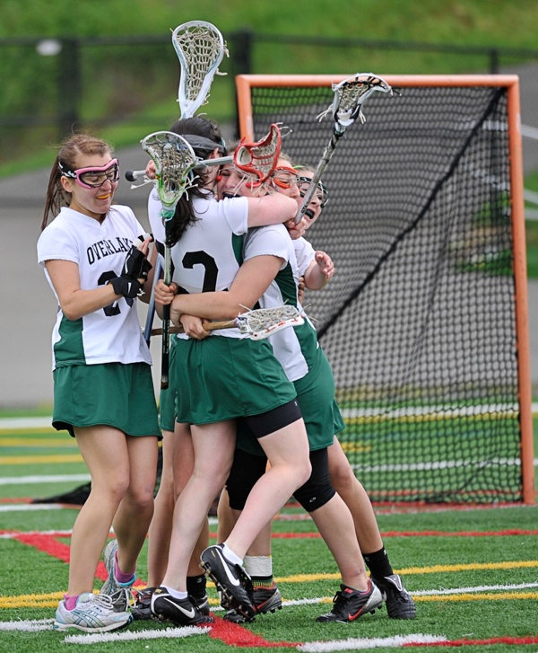 A flock of Owls celebrate after Overlake’s Grace Grubb (third from left) scored with one second remaining in regulation to send the girls Division II state championship into overtime.  The Owls fell to Bellevue East 17-16 in overtime.