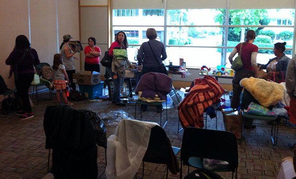 Members of Buy Nothing Redmond gather at the Redmond Library for a community event.