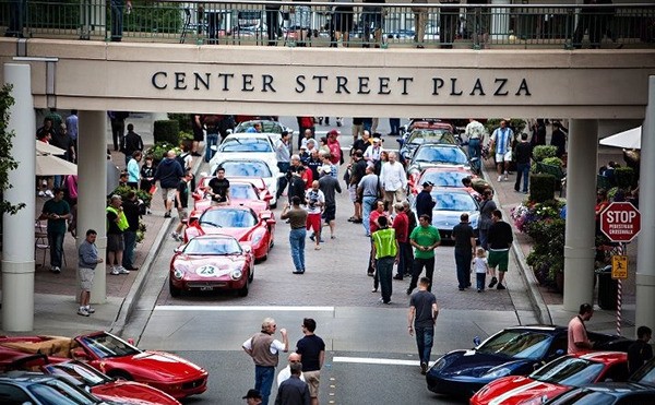 Exotic cars line Center Street Plaza.