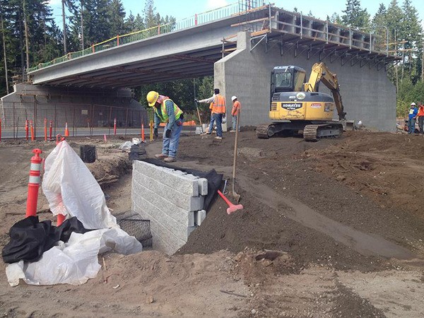 Workers dig and build away over the summer at the future wildlife crossing on Redmond Ridge.