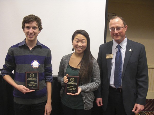 Aron Daw (left) and Rachel Kim received Student of the Month awards from the Rotary Club of Redmond on Dec. 15. Rotary President Steve Bozick (right) presented them with the awards.