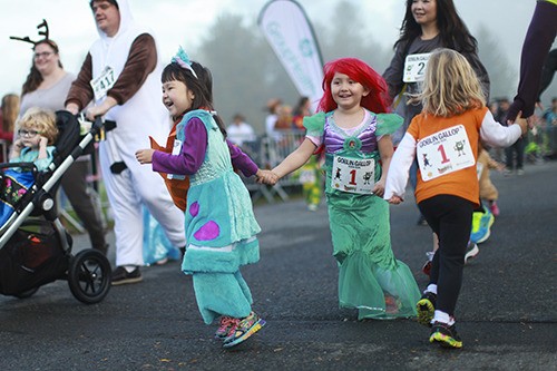 Costumed kids and adults enjoy themselves at last Sunday’s Goblin Gallop 5K run/walk at Marymoor Park to benefit the Group Health Foundation.