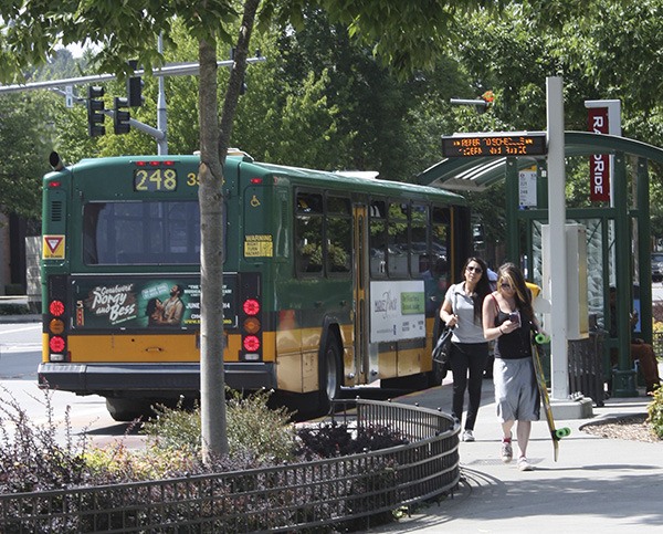 People exit the bus near the Redmond Transit Center.