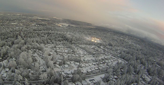 This is a view of snow-covered downtown taken from Redmond resident Zach Sweetser's remote control airplane. Marymoor Park and Lake Sammamish are seen in the right corner.