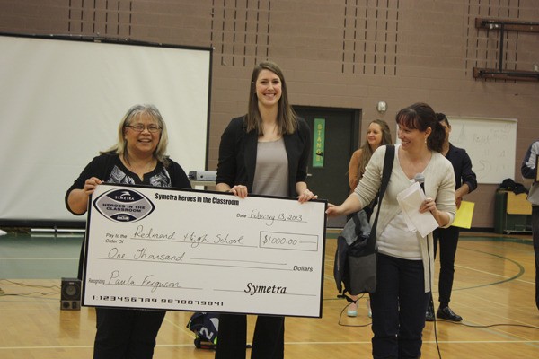 Redmond High School orchestra director Paula Ferguson (left) was recognized by the Seattle Seahawks and Symetra as a Hero in the Classroom.