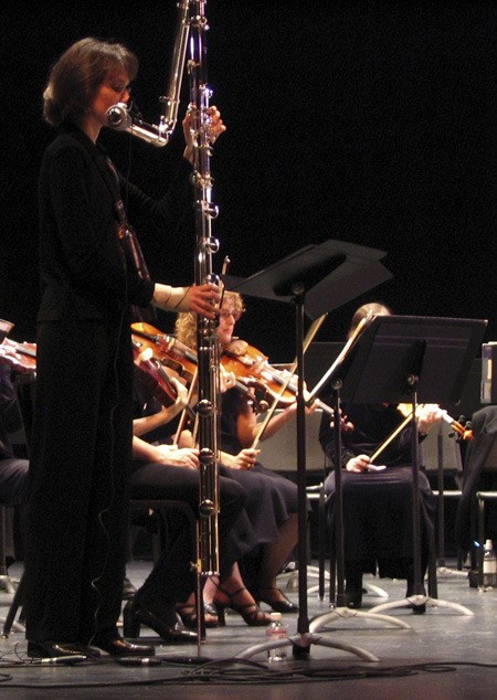 Lisa Hedley will be performing solos at the Eastside Symphony's upcoming spring concert on March 17. She has a collection of about two dozen flutes including a contrabass flute