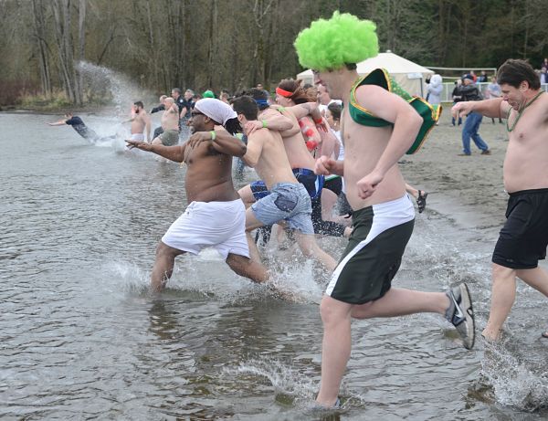 Brave people participate in yesterday's Redmond Police Department annual Polar Plunge for Special Olympics Washington at Idylwood Beach Park in Redmond.