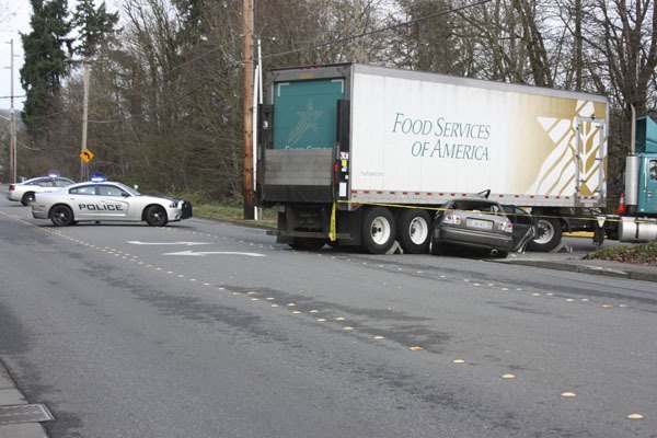 A semi-truck collided with a car on Willows Road in Redmond Monday morning. The driver of the car was taken to Harborview with serious injuries.