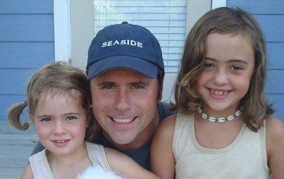 Johnny Brenan (center) was one of three individuals who died in an avalanche at Stevens Pass on Sunday. He is pictured with his two daughters.