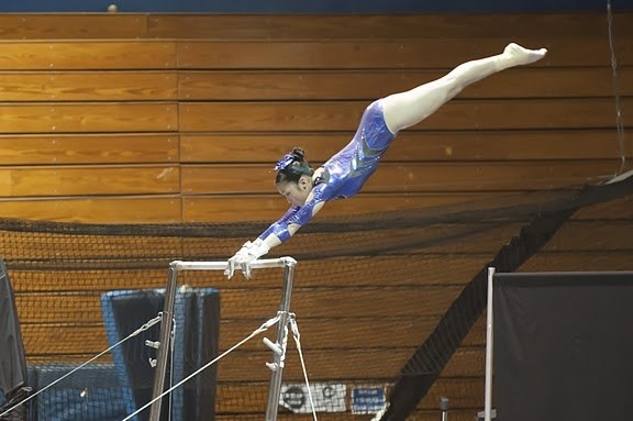 Redmond High junior Alexa Okamura performs her bars routine at the Region 2 Championships in Pullman last weekend. Okamura placed fourth overall with a 36.60 all-around and earned a berth to the Junior Olympic Nationals in Long Beach on May 13.