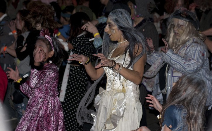 Nearly 300 dancing zombies particpated in Saturday's 'Thrill the World' dance and benefit event at Redmond Town Center.