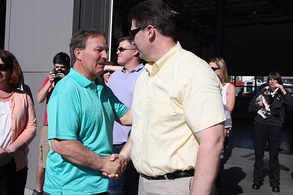 Dan Kerr (left) shakes hands with Lance Traicoff