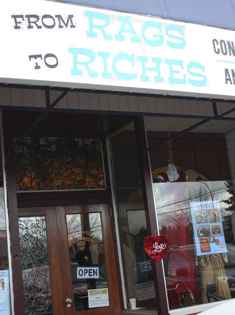 A decorative heart emblazoned with the word “Love” hangs on the From Rags to Riches storefront in January. Redmond Reporter file photo