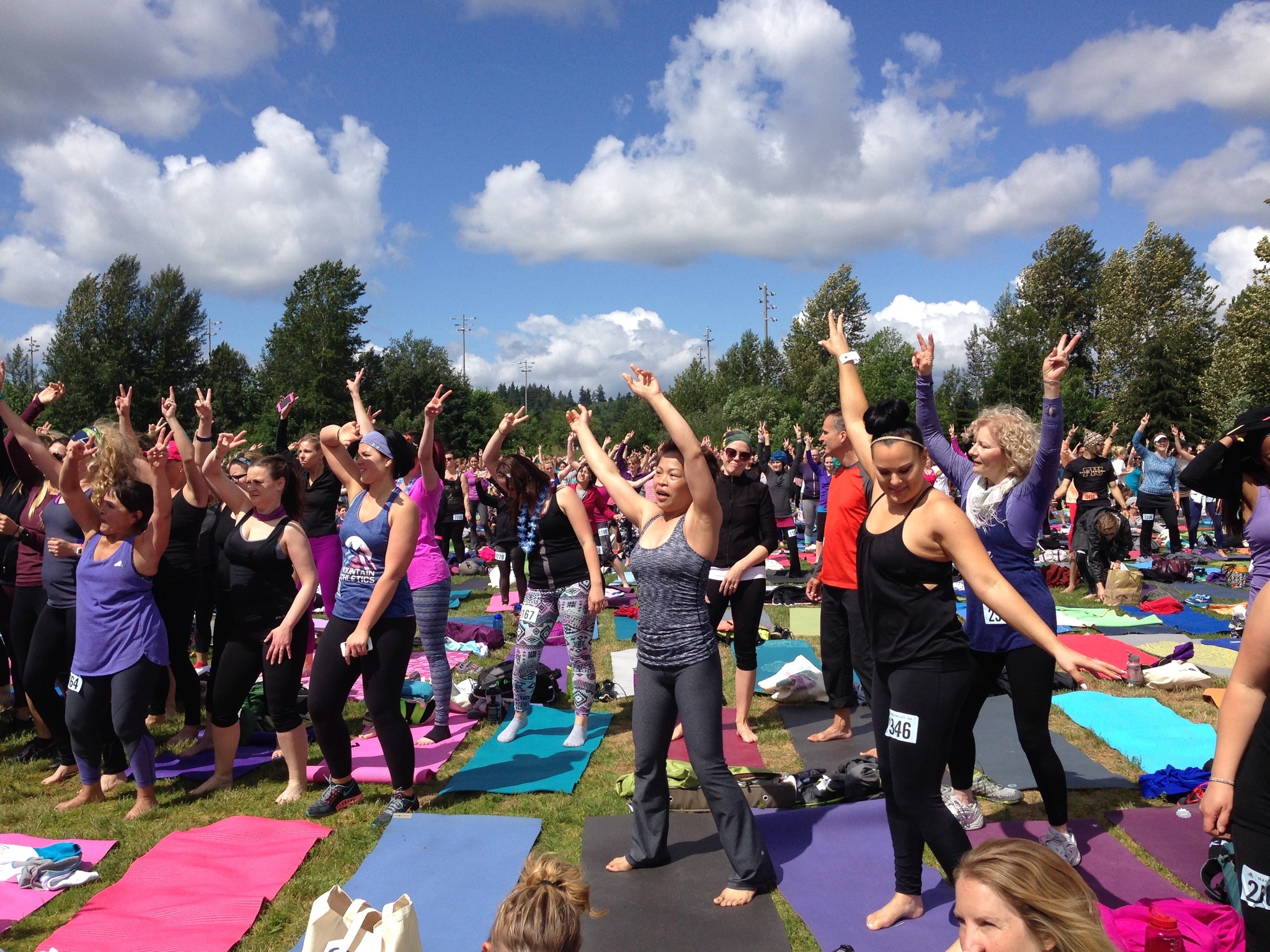 Wanderlust 108 attendees enjoy a dance party at Marymoor Park to the music of MC Yogi before getting on their mats for a 75-minute yoga practice session. Samantha Pak