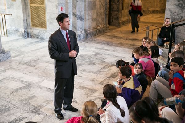 Sen. Andy Hill talks with students in the Washington State Capitol building.