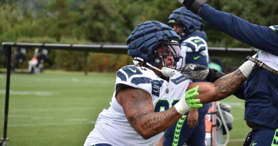 Byron Murphy II gets going during a defensive line drill. Ben Ray / Sound Publishing