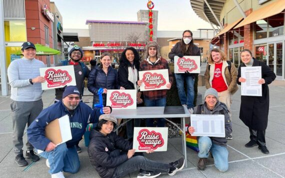 A group of volunteers from Raise the Wage Renton, shown gathering signatures in 2023. Renton residents approved a higher minimum wage for the city in a Feb. 2024 special election. (Photo courtesy of Raise the Wage Renton)